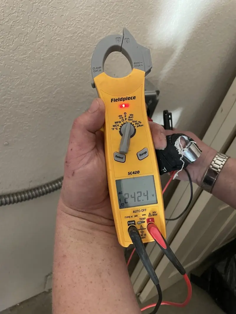 Voltage testing with clamp meter during Electrical Installation Services in East Buffalo